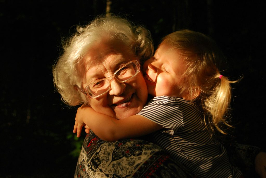 little girl hugging grandma